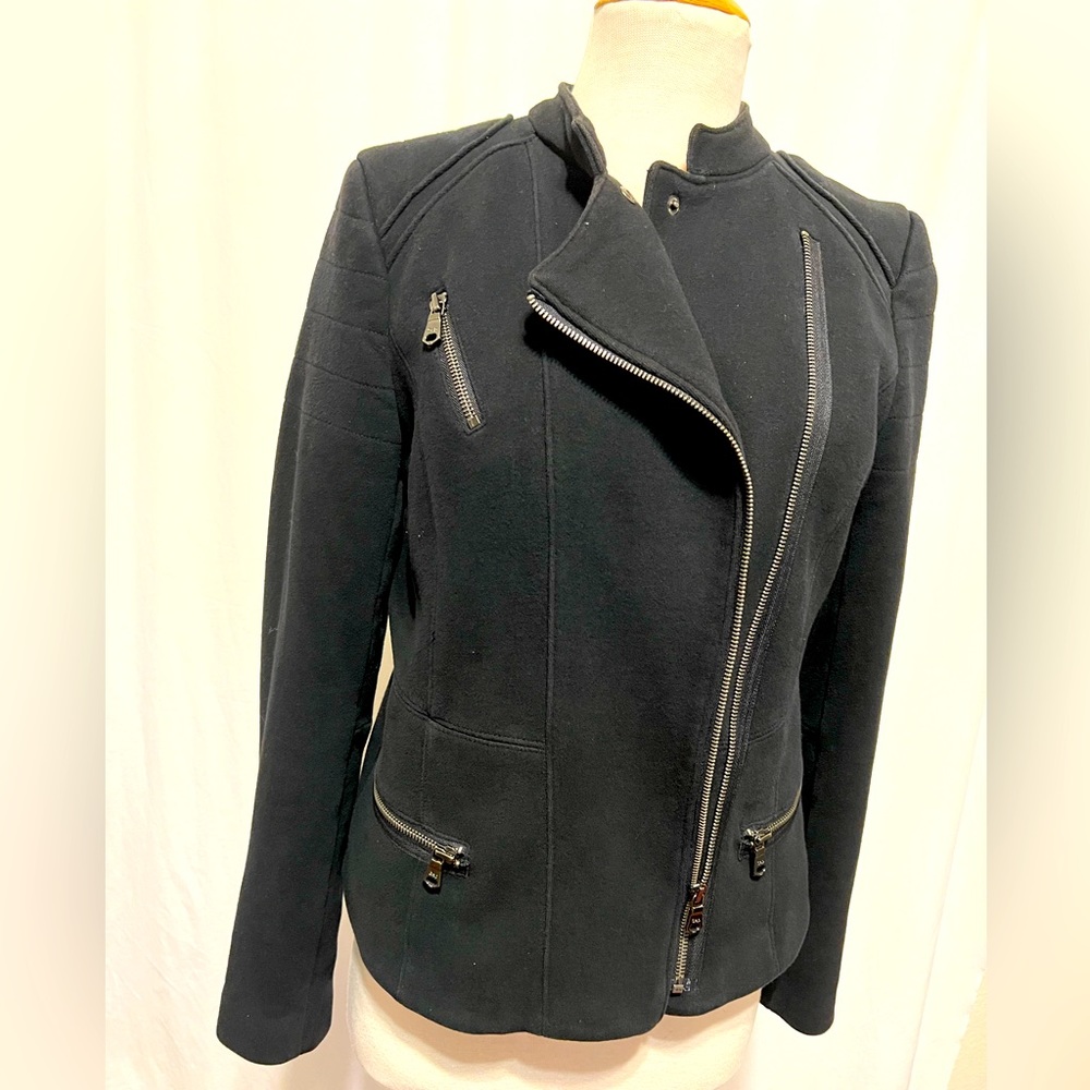 Asymmetrical zip front knit jacket.